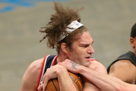 Why Wizards center Robin Lopez recently started wearing a headband