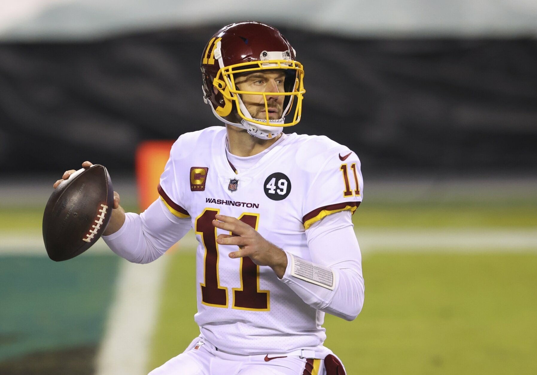 FILE - Washington Football Team quarterback Alex Smith (11) is shown in action against the Philadelphia Eagles during an NFL football game in Philadelphia, in this Sunday, Jan. 3, 2021, file photo. Smith announced his retirement Monday, April 19, 2021, on Instagram, saying he still has plenty of snaps left him just shy of his 37th birthday but is calling it quits to enjoy time with his family. (AP Photo/Rich Schultz, FIle)