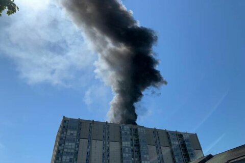 Dozens of firefighters respond to blaze atop Bethesda high-rise