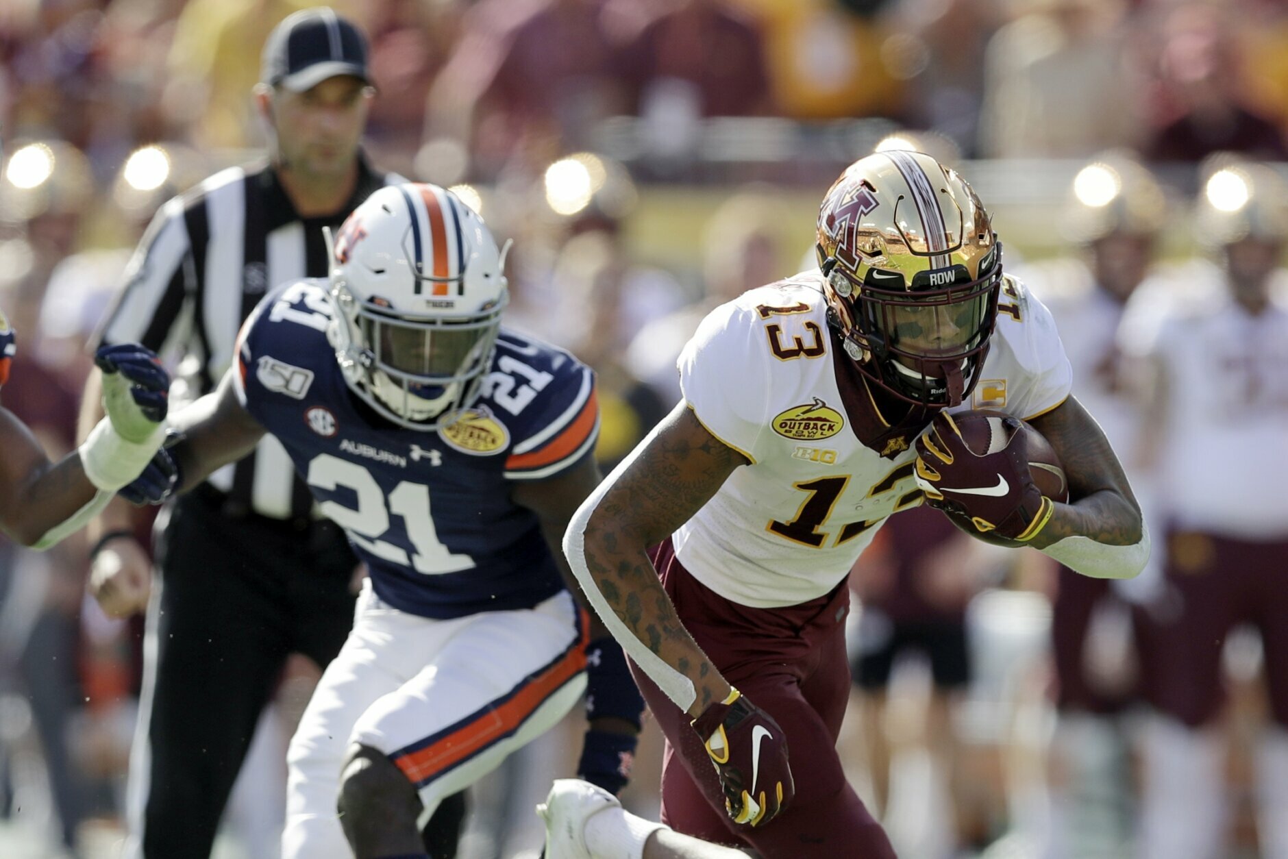 FILE - In this Jan. 1, 2020, file photo, Minnesota wide receiver Rashod Bateman (13) turns upfield against Auburn during the first half of the Outback Bowl NCAA college football gam in Tampa, Fla. Baltimore ranked last in the NFL averaging 171.2 yards passing per game and had the fewest pass attempts with 406 last season. That’s partly because the running game was so proficient behind quarterback Lamar Jackson, the catalyst for the league’s No. 1 rushing attack (191.9 yards per game) for the second straight season. (AP Photo/Chris O'Meara, File)