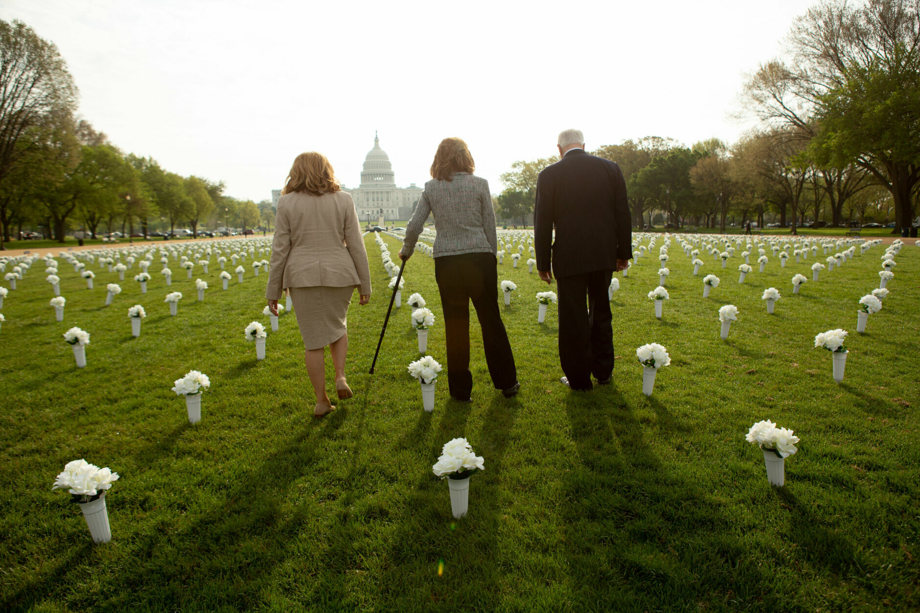 A press conference inaugurates the Gun Violence Memorial, a temporary installation consisting of 40,000 silk flowers, on the National Mall in Washington, D.C., April 14, 2021. (photo by Allison Shelley/Emic Films)