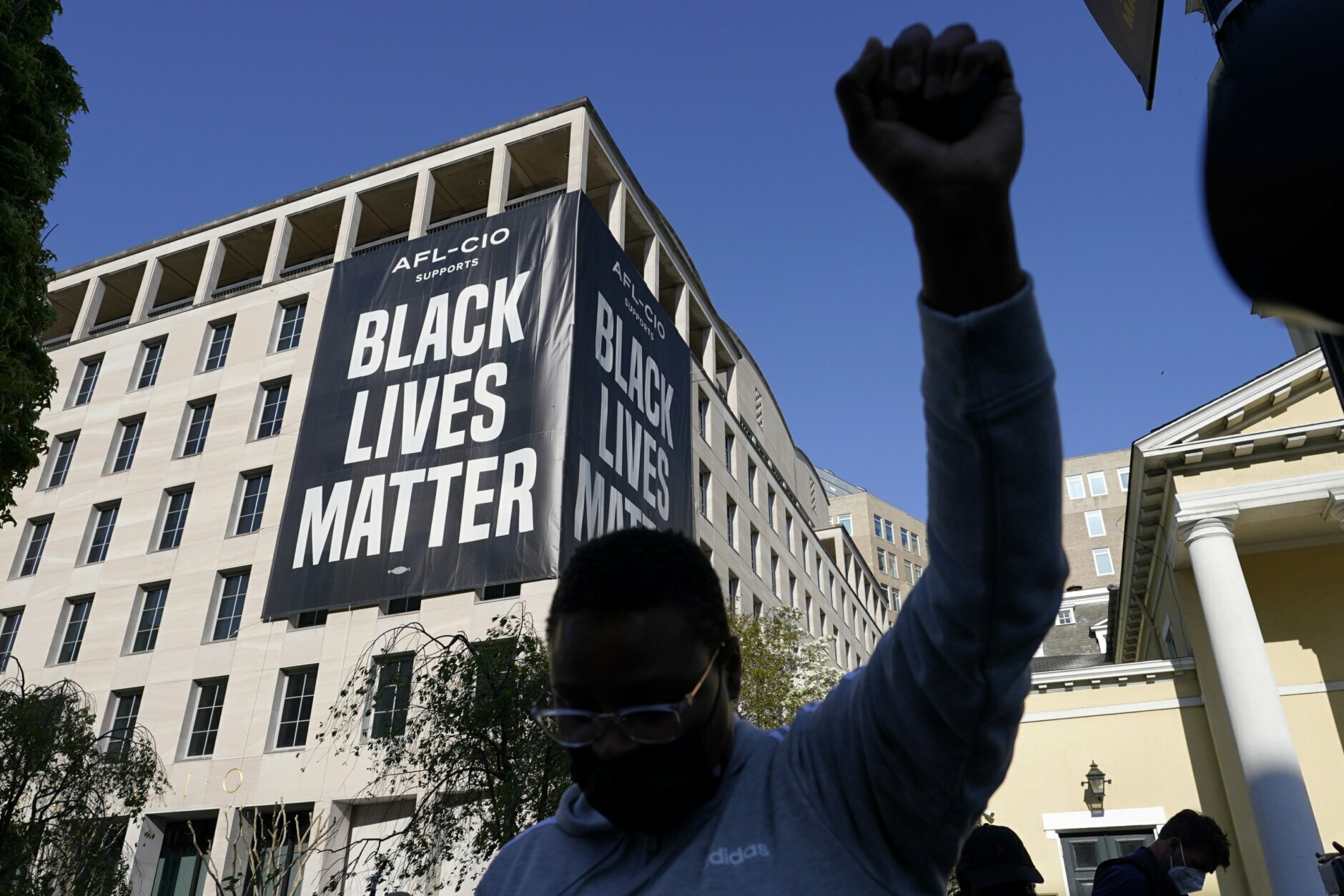 A person reacts on Tuesday, April 20, 2021, in Washington, at Black Lives Matter Plaza near the White House after the verdict in Minneapolis, in the murder trial against former Minneapolis police officer Derek Chauvin was announced. (AP Photo/Alex Brandon)