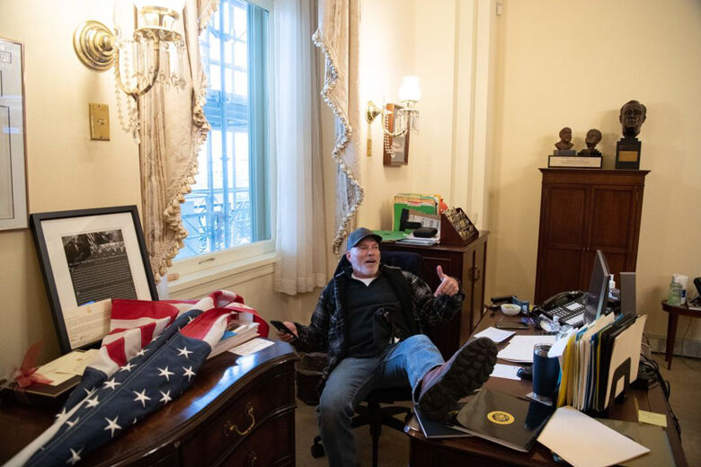 <p>Richard Barnett, a supporter of former President Donald Trump sits inside the office of U.S. Speaker of the House Nancy Pelosi inside the U.S. Capitol in Washington, D.C., Jan. 6, 2021. — Demonstrators breeched security and entered the Capitol as Congress debated the a 2020 presidential election Electoral Vote Certification.</p>
