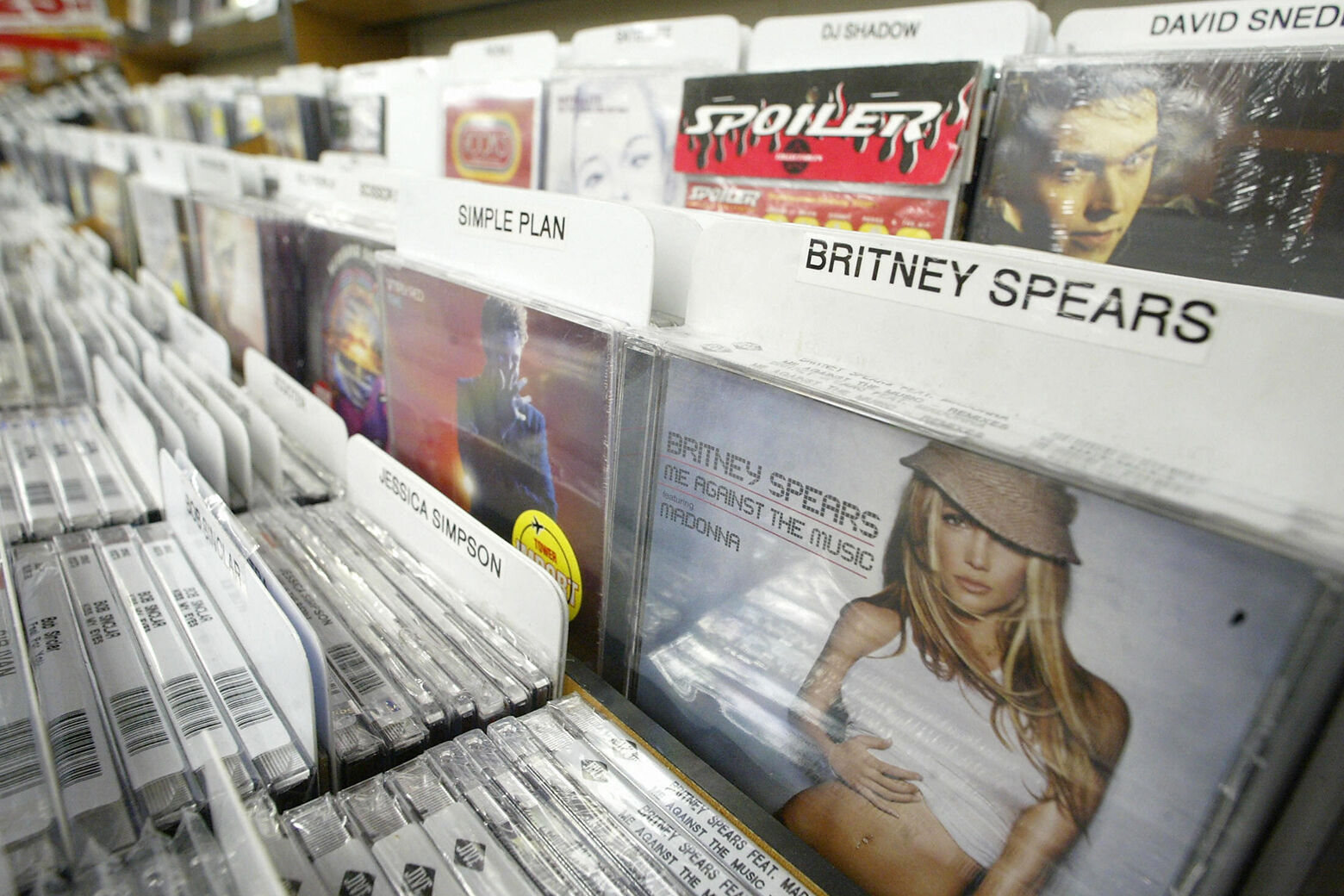 <p>HOLLYWOOD, UNITED STATES: Britney Spears and other popular music CDs for sale at a Tower Records store in Hollywood, California, 06 February 2004. Tower, the pioneering record retailer that invented the music megastore, plans to move forward on a pre-packaged Chapter 11 bankruptcy filing next week. AFP PHOTO / ROBYN BECK (Photo credit should read ROBYN BECK/AFP via Getty Images)</p>
