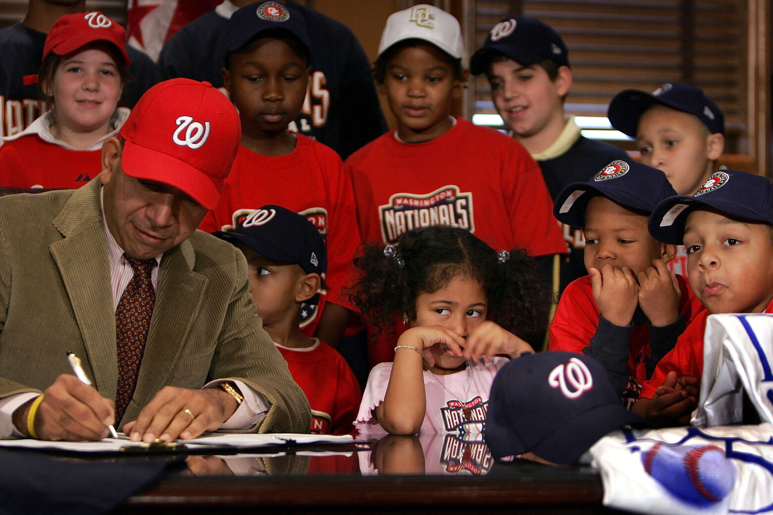 <p>WASHINGTON &#8211; DECEMBER 29: Surrounded by children, District of Columbia Mayor Anthony A. Williams signs the Ballpark Omnibus Financing and Revenue Act of 2004 that continues the process of returning baseball to the nation&#8217;s capital December 29, 2004 in Washington, DC. The Washington Nationals are scheduled to begin play at Robert F. Kennedy Memorial Stadium in the spring of 2005. (Photo by Joe Raedle/Getty Images)</p>
