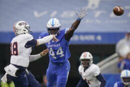 FILE - Kentucky linebacker Jamin Davis (44) rushes UT Martin quarterback John Bachus III (18) during the first half of an NCAA college football game in Lexington, Ky., in this Saturday, Nov. 23, 2019, file photo. Davis is a possible first round pick in the NFL Draft, April 29-May 1, 2021, in Cleveland. (AP Photo/Bryan Woolston, FIle)