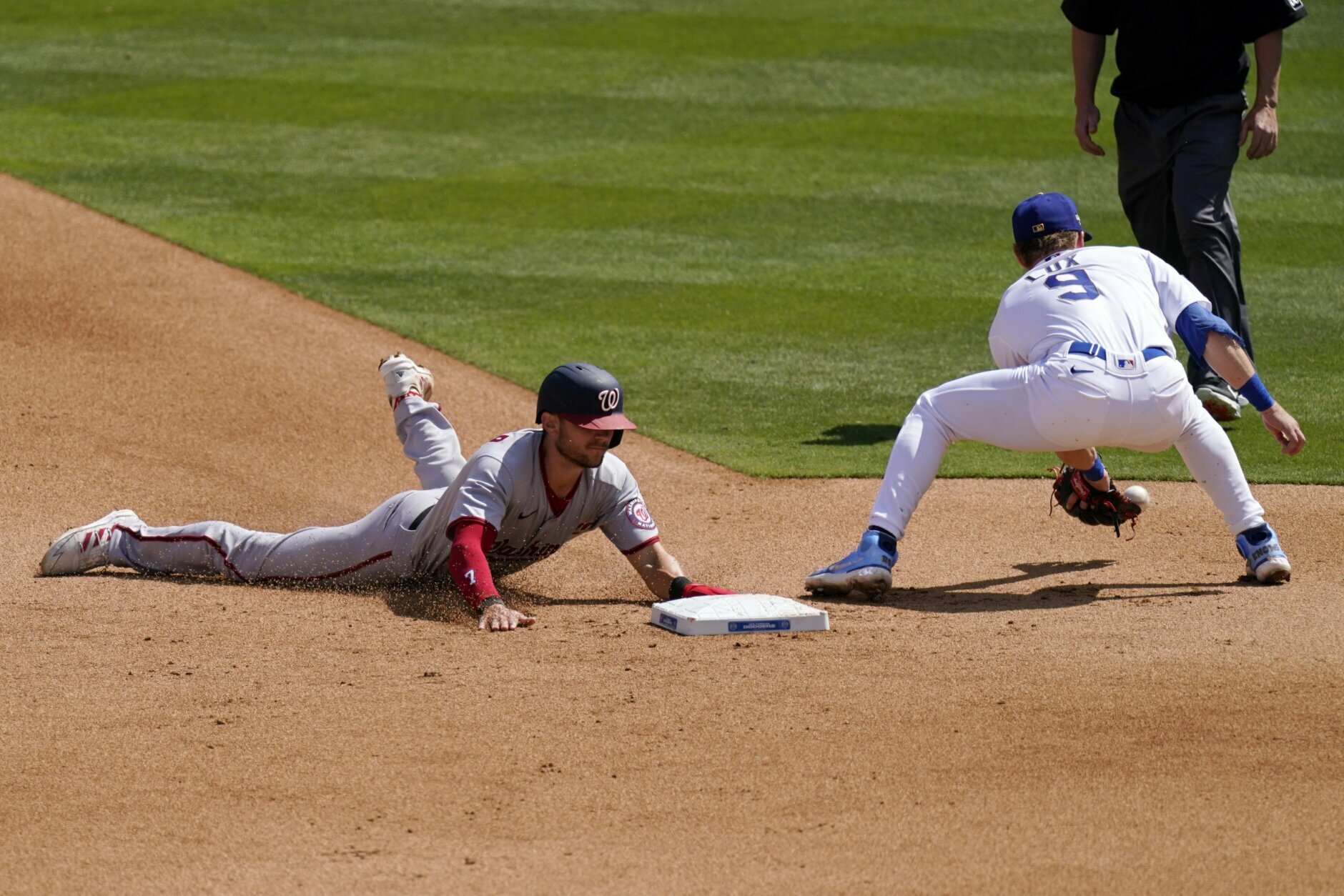 Infielder Trea Turner of the Los Angeles Dodgers throws a ball into