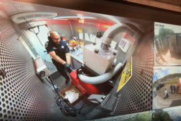 An ATF analyst test fires a ghost gun inside the ATF's Crime Gun Intelligence Mobile Command Center. (WTOP/Jack Moore)