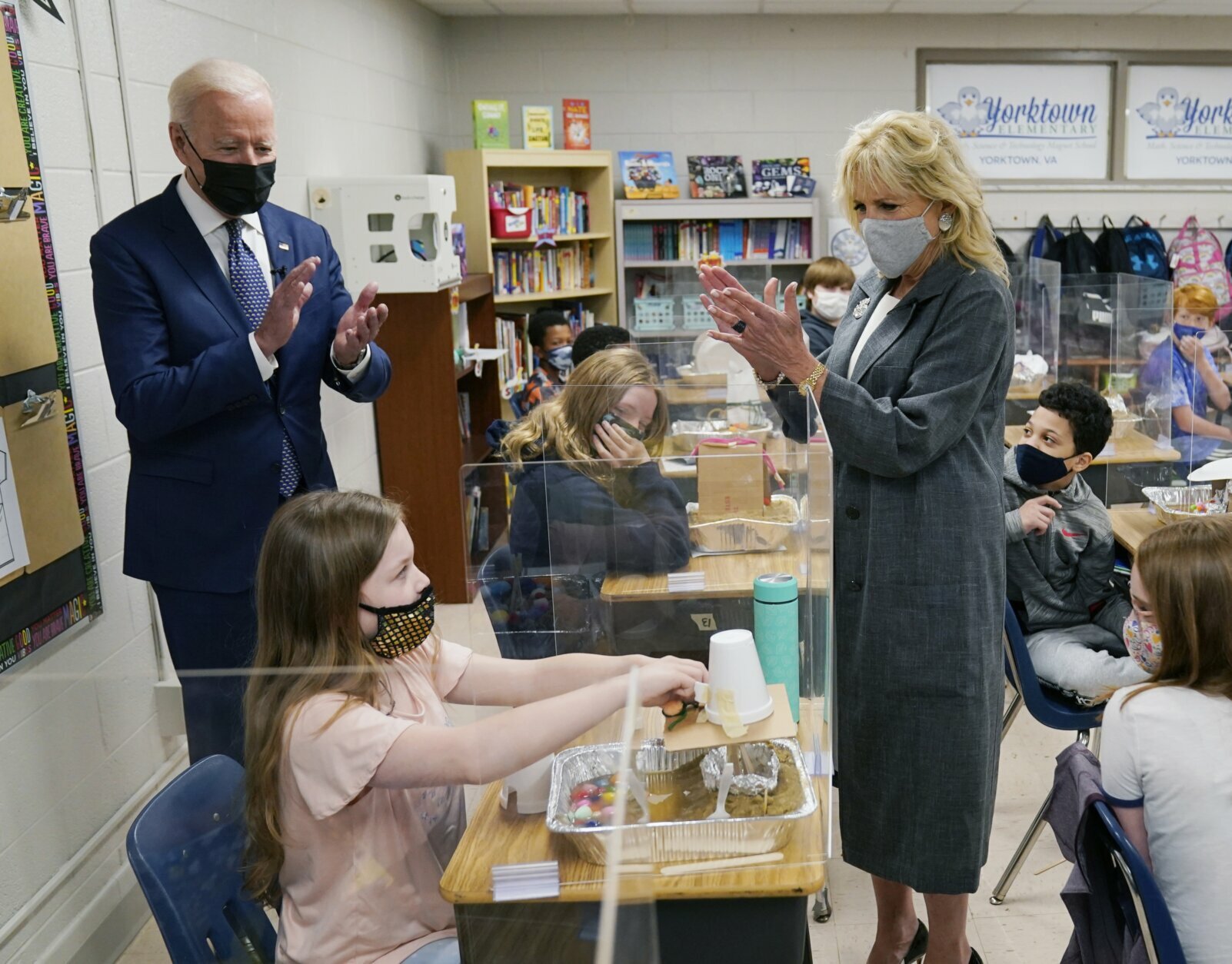 President Joe Biden and first lady Jill Biden applaud a student as she demonstrates her project, during a visit to Yorktown Elementary School, Monday, May 3, 2021, in Yorktown, Va. (AP Photo/Evan Vucci)