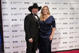 2020 Kennedy Center honoree, country singer-songwriter Garth Brooks stands with his wife, Trisha Yearwood, at the 43nd Annual Kennedy Center Honors at The Kennedy Center on Friday, May 21, 2021, in Washington. (AP Photo/Kevin Wolf)