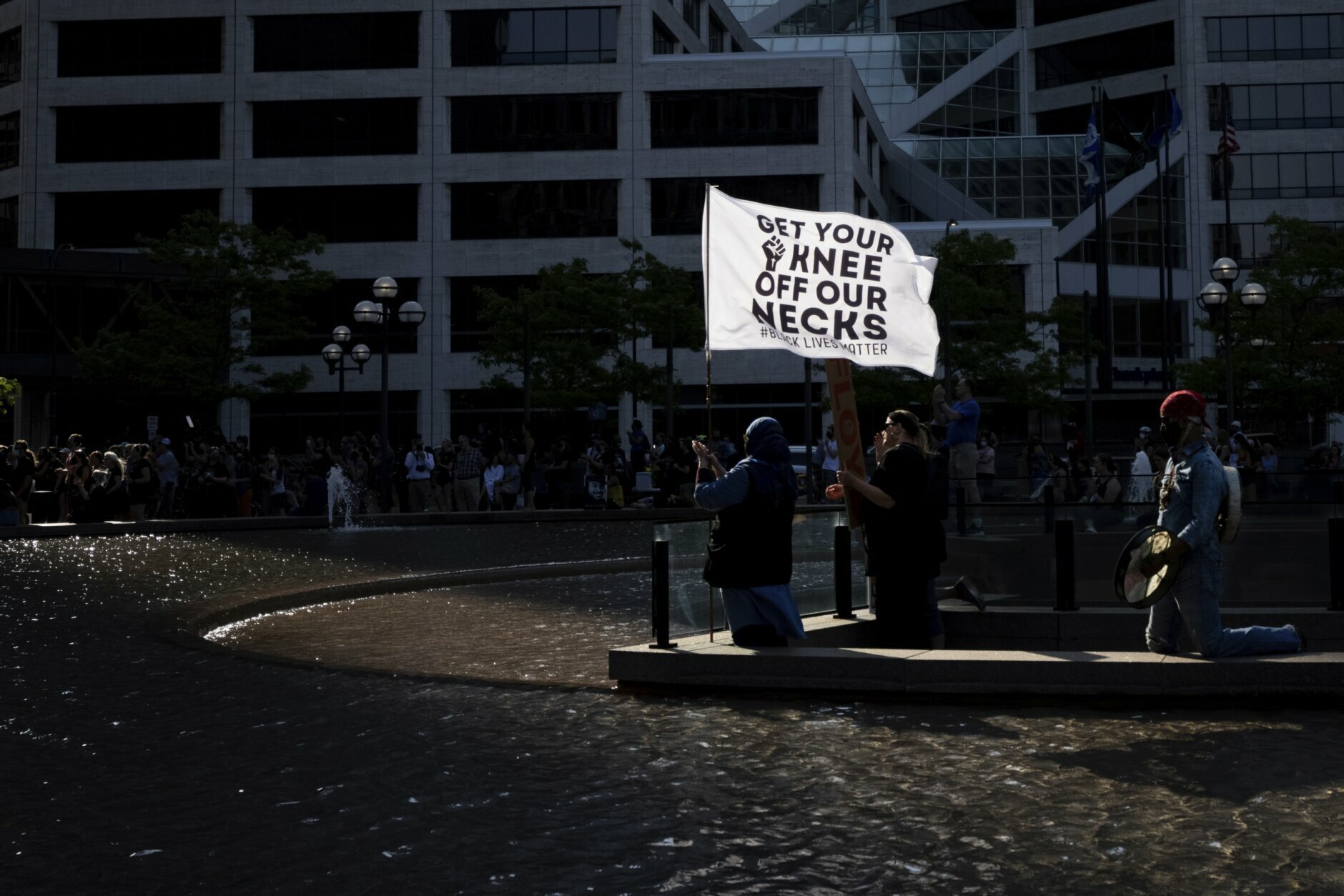 People attend a rally and march for the one year anniversary of George Floyd's death on Sunday, May 23, 2021, in Minneapolis, Minn. (AP Photo/Christian Monterrosa)
