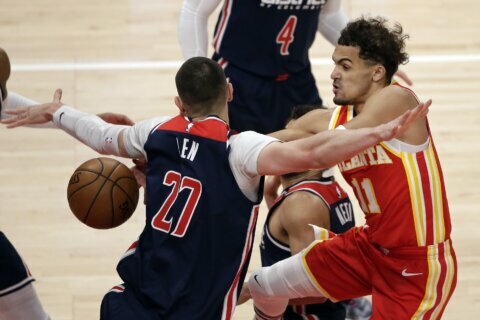 Young rallies Hawks to playoff berth, 120-116 over Wizards