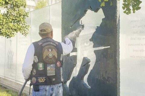 Local veterans help clean DC memorial