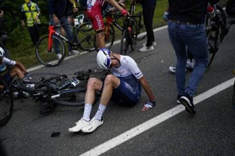 French officials open investigation after Tour de France spectator causes massive crash