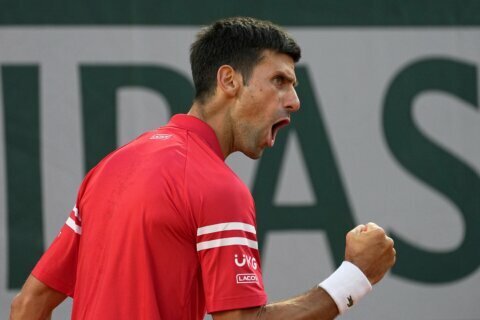 Novak Djokovic rallies to beats Stefanos Tsitsipas 6-7 (6), 2-6, 6-3, 6-2, 6-4 in French Open final for 19th major title