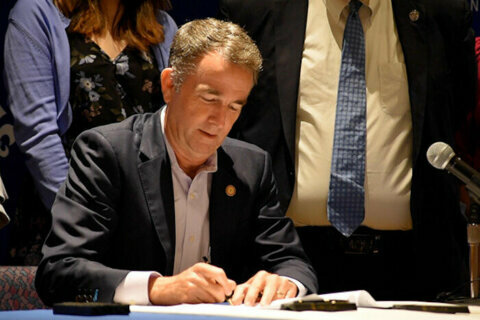 Virginia governor signs law that expands eligibility for state financial aid