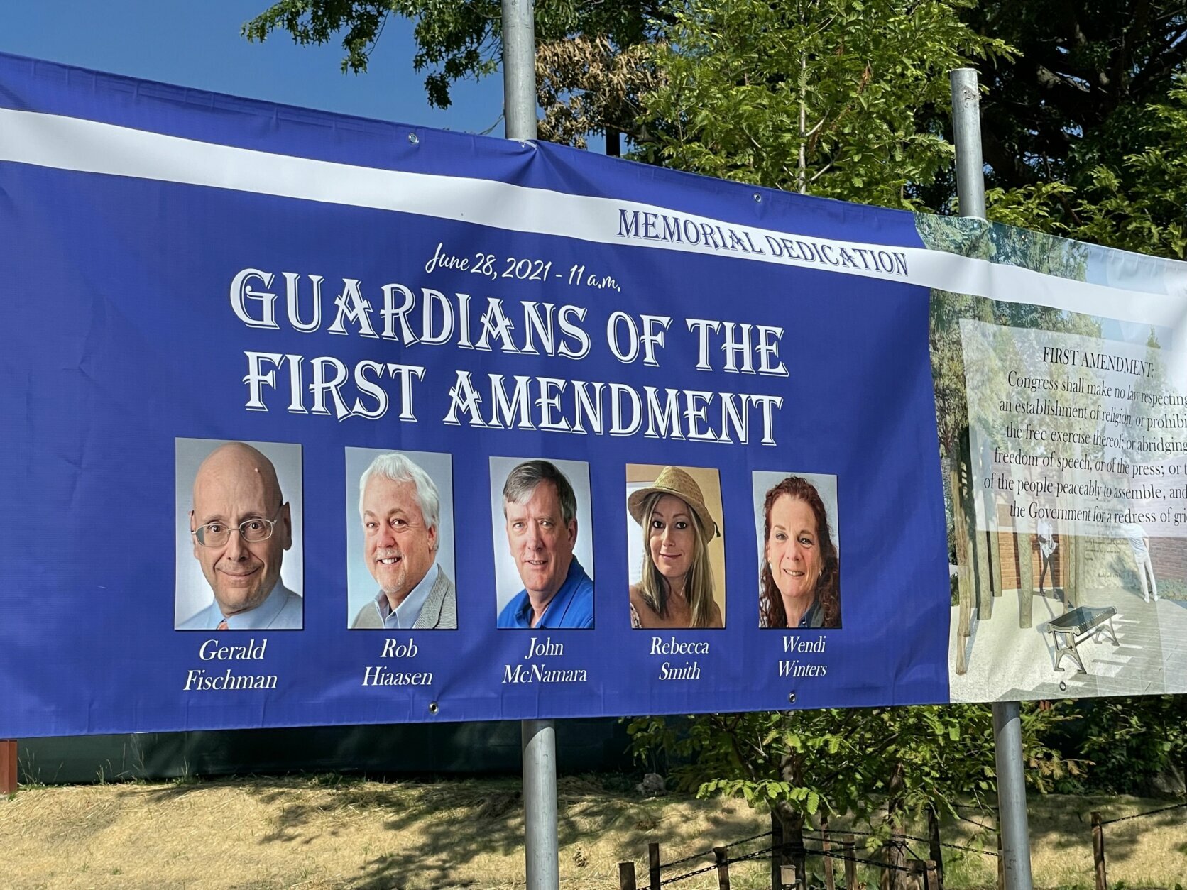 Survivors and family members of victims of the five people who died in a mass shooting at the Capital Gazette newspaper dedicated a memorial to them and the First Amendment on Monday on the third anniversary of the attack (WTOP/Meghan Cloherty).