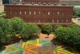 Artist Lisa Marie Thalhammer  of DC was commissioned by the Downtown DC Business Improvement District earlier this year, to use her artistic talents to create a design using lawn paint that promotes social distancing for the organization’s DowntownDC Summer Flicks series. It's called "Equilateral Network."