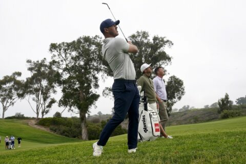 The Latest: First round of U.S. Open suspended by darkness