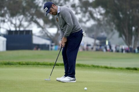 The Latest: Henley, Bland lead, Mickelson advances