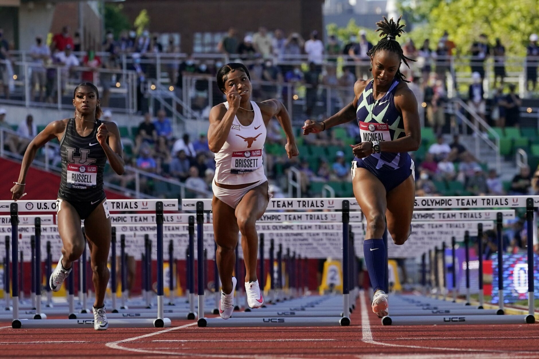 <p>Anna Cockrell, right, wins the fourth heat of the women&#8217;s 100-meter hurdles at the U.S. Olympic Track and Field Trials Saturday, June 19, 2021, in Eugene, Oregon.</p>
