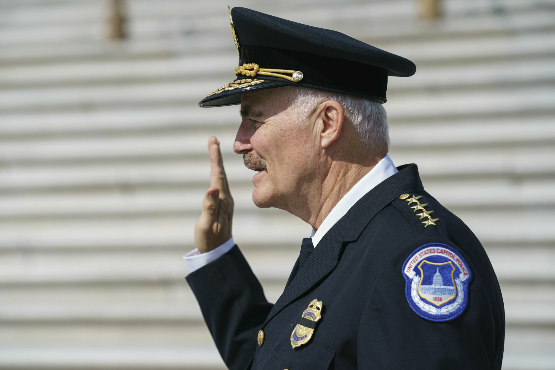 J. Thomas Manger, a veteran police chief of departments in the Washington, D.C., region, raises his hand as he accepts the oath to take over the United States Capitol Police following the resignations of the previous leadership after the Jan. insurrection, the Capitol in Washington, Friday, July 23, 2021. (AP Photo/J. Scott Applewhite)