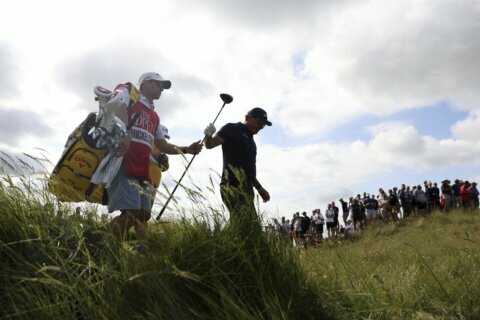 The Latest: Oosthuizen sets 36-hole Open record to lead by 2