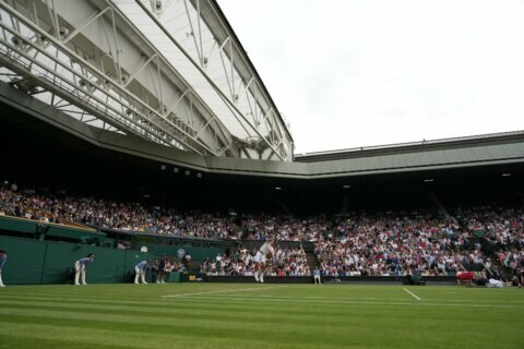 The Latest: Medvedev rallies from 2 sets down at Wimbledon