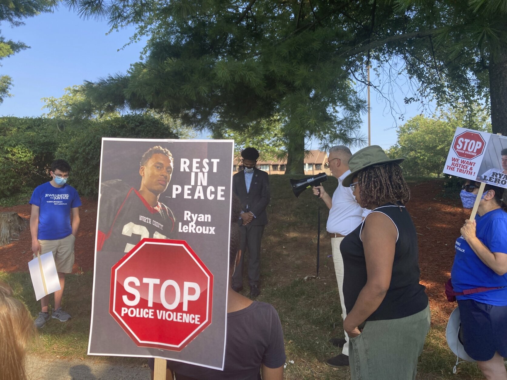Activists gather for a vigil on Tuesday, July 27, 2021 near the McDonald’s restaurant in Gaithersburg, Md. where Ryan LeRoux, a 21-year-old Black man, was shot and killed by police on July 16. (AP Photo/Michael Kunzelman)