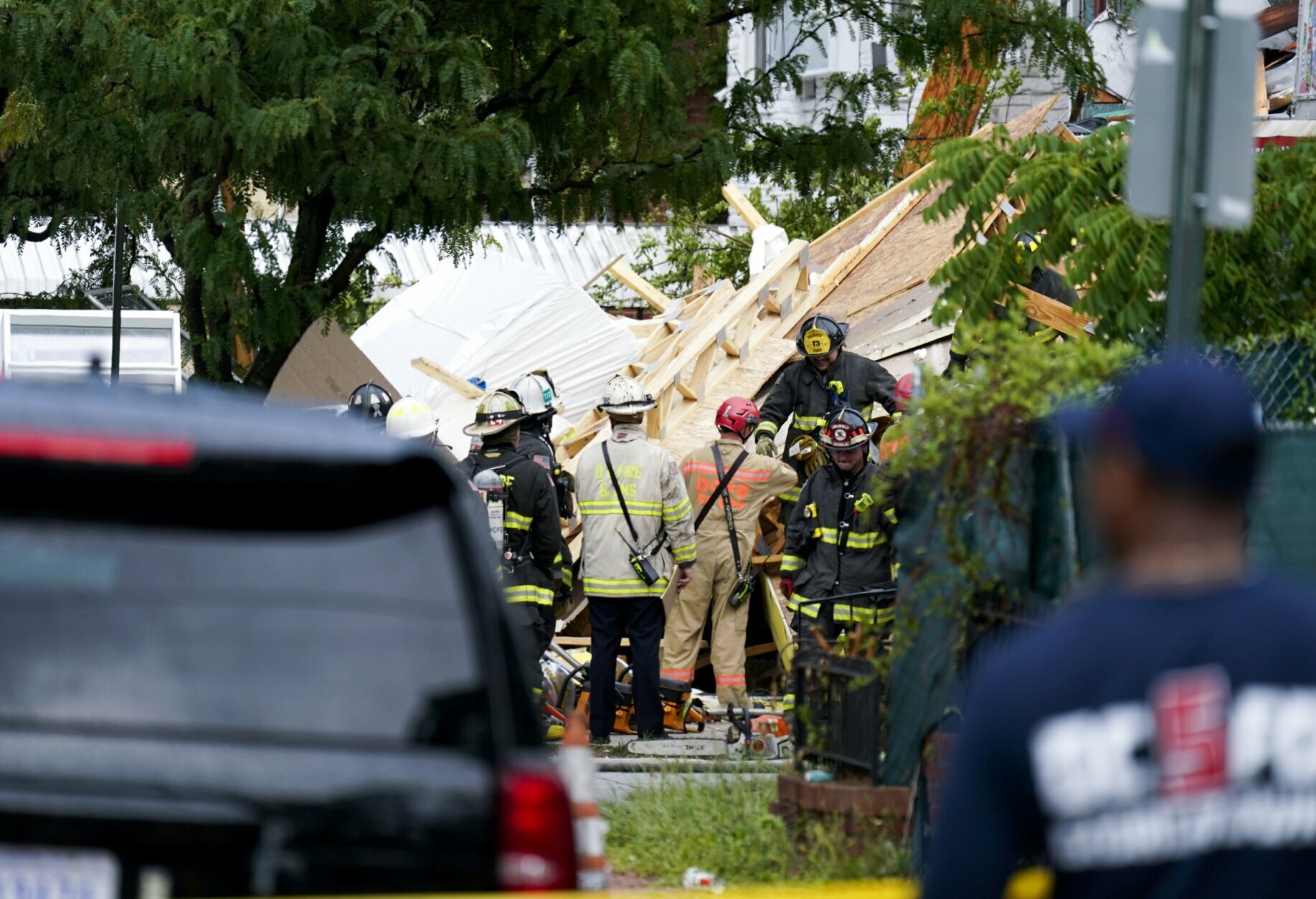 Emergency crews respond after a building under construction collapsed Thursday, July 1, 2021, in Washington. 