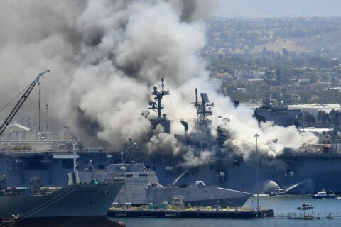 Navy charges sailor with setting fire that destroyed warship