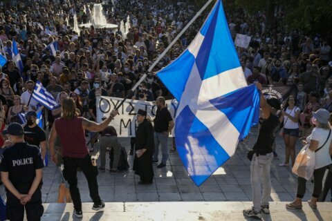 Plan to vaccinate teens triggers large protests in Greece
