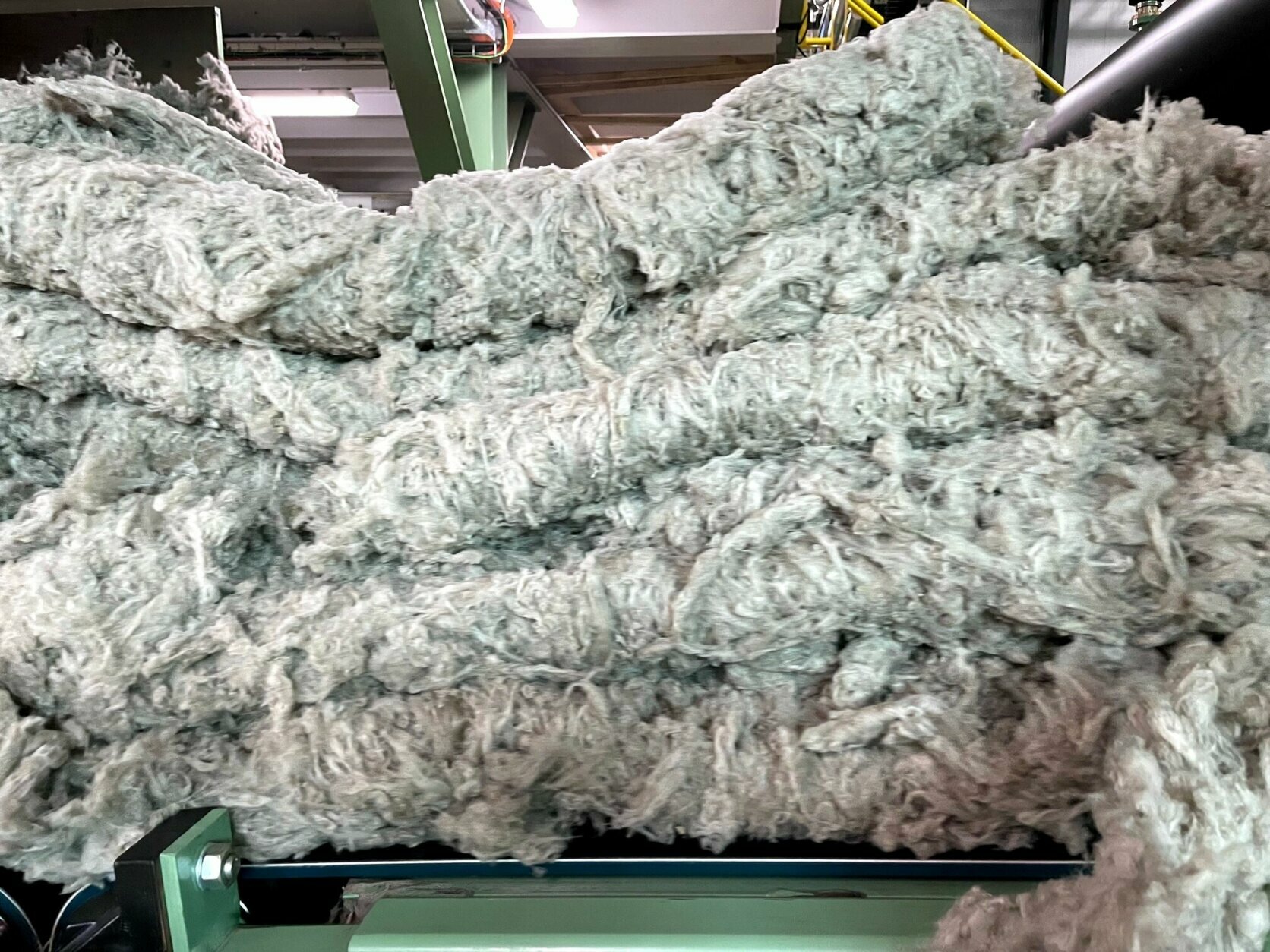 <p>The process in which the cotton-candy-consistency stone wool is turned into a loosely formed blanket is proprietary, according to Espinosa. During the WTOP tour of the factory, no photos were allowed of the machinery used during the melting furnace, spinning, or curing portions of the process.</p>
