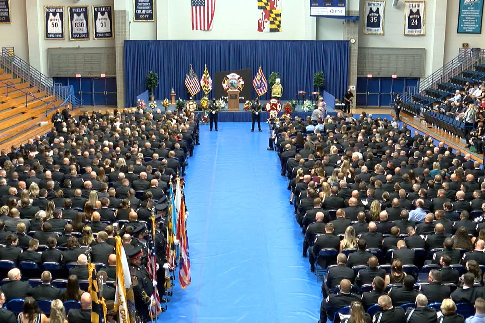 Mourners at the funeral service for Frederick County firefighter Joshua Laird at Mount St. Mary's University PNC Sports Complex.