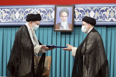 Iran swears in new hard-line president amid regional tension