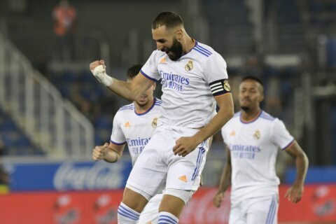 Benzema stays hot, leads Real Madrid to victory in opener