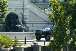 <p>A pickup truck is parked on the sidewalk in front of the Library of Congress&#8217; Thomas Jefferson Building, as seen from a window of the U.S. Capitol, Thursday, Aug. 19, 2021, in Washington. A man sitting in the pickup truck outside the Library of Congress has told police that he has a bomb, and that&#8217;s led to a massive law enforcement response to determine whether it&#8217;s an operable explosive device.</p>
