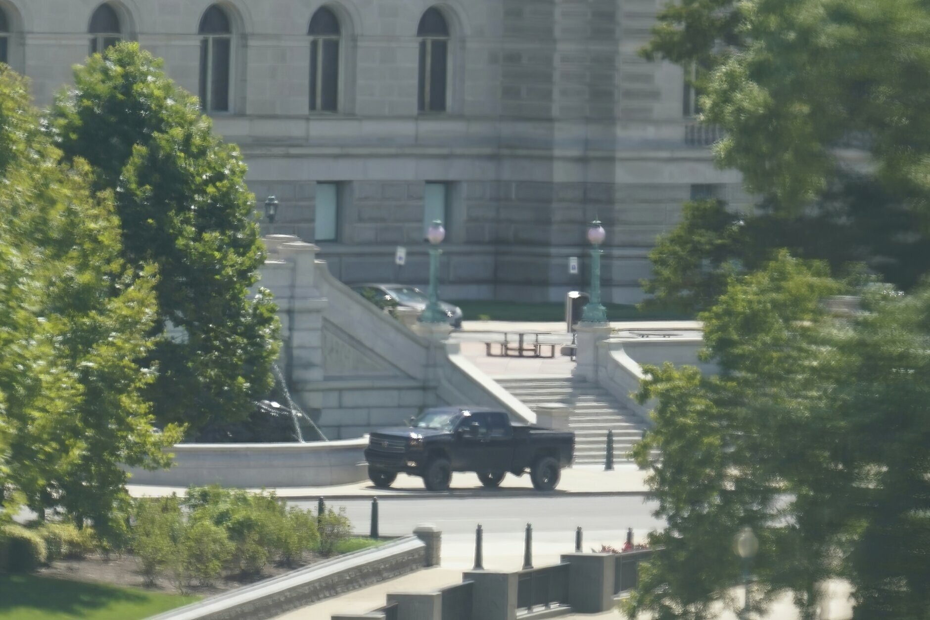 <p>A pickup truck is parked on the sidewalk in front of the Library of Congress&#8217; Thomas Jefferson Building, as seen from a window of the U.S. Capitol, Thursday, Aug. 19, 2021, in Washington. A man sitting in the pickup truck outside the Library of Congress has told police that he has a bomb, and that&#8217;s led to a massive law enforcement response to determine whether it&#8217;s an operable explosive device.</p>
