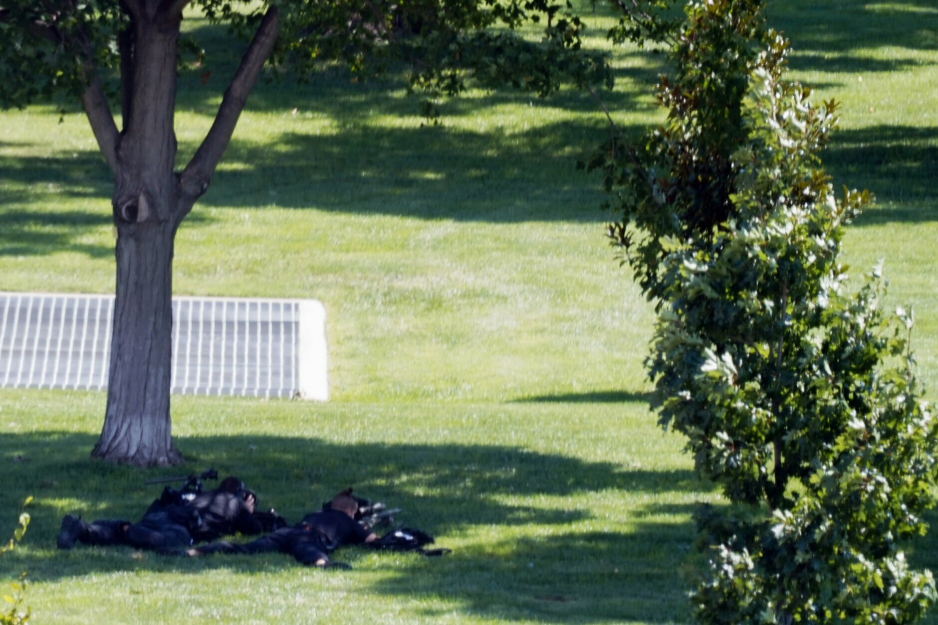 <p>This image taken through a window shows two law enforcement with rifles near the Library of Congress and the U.S. Capitol building in Washington on Thursday, Aug. 19, 2021. Police are investigating a report Thursday of a possible explosive device in a pickup truck outside the Library of Congress on Capitol Hill and have evacuated multiple buildings on the sprawling Capitol complex, two law enforcement officials told The Associated Press.</p>
