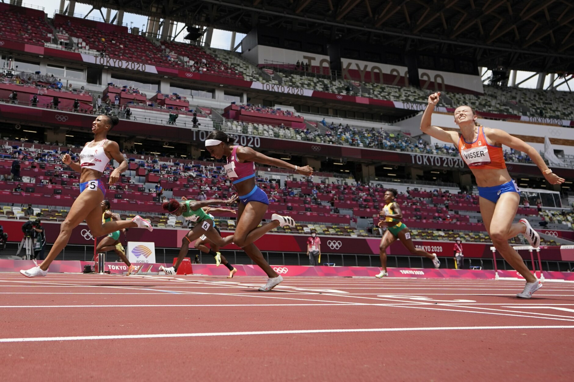 Jasmine Camacho-Quinn, left, of Puerto Rico, wins the women's 100-meters hurdles final at the 2020 Summer Olympics, Monday, Aug. 2, 2021, in Tokyo. (AP Photo/David J. Phillip)