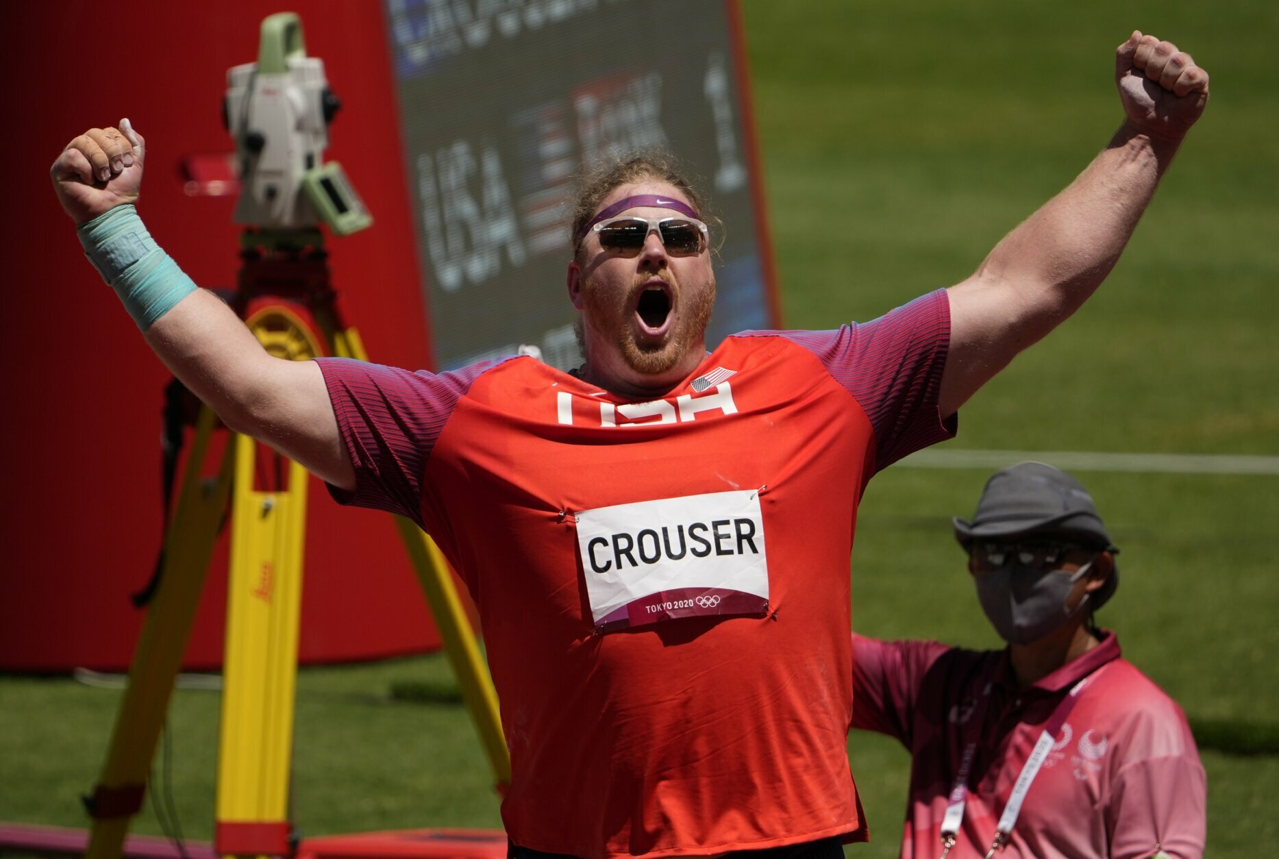 Ryan Crouser, of United States celebrates in the final of the men's shot put at the 2020 Summer Olympics, Thursday, Aug. 5, 2021, in Tokyo, Japan. (AP Photo/Charlie Riedel)
