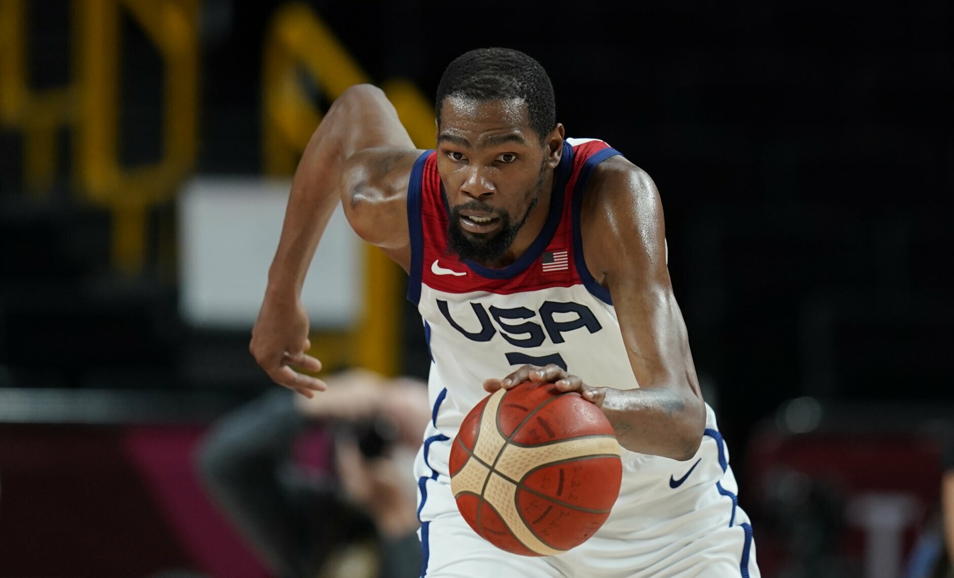 United States' Kevin Durant (7) chases the ball during men's basketball gold medal game against France at the 2020 Summer Olympics, Saturday, Aug. 7, 2021, in Saitama, Japan. (AP Photo/Charlie Neibergall)