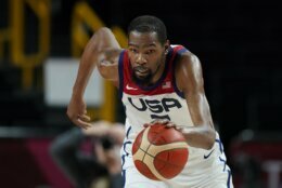 United States' Kevin Durant (7) chases the ball during men's basketball gold medal game against France at the 2020 Summer Olympics, Saturday, Aug. 7, 2021, in Saitama, Japan. (AP Photo/Charlie Neibergall)