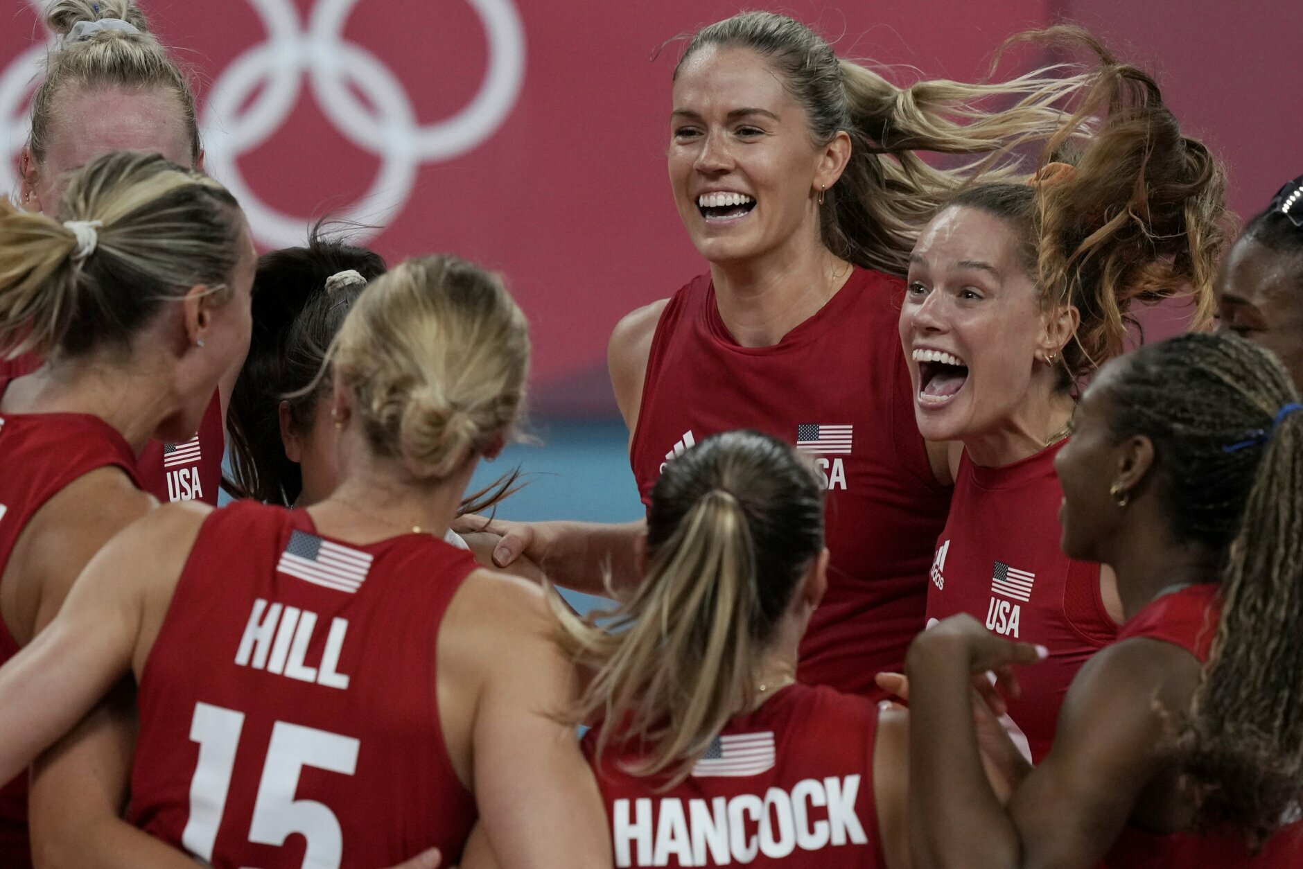 United states players celebrate winning the women's volleyball preliminary round pool B match between United States and Italy at the 2020 Summer Olympics, Monday, Aug. 2, 2021, in Tokyo, Japan. (AP Photo/Frank Augstein)
