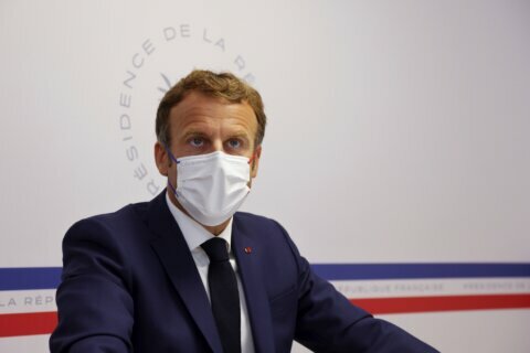 Macron warns virus is ‘not behind us;’ urges vaccination