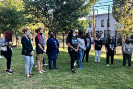 Teachers and staff at Ketcham Elementary School watch as memorial plaque is given to Janil Debeuneure, the daughter of a Ketcham teacher who was killed on 9/11. (WTOP/Nick Iannelli)