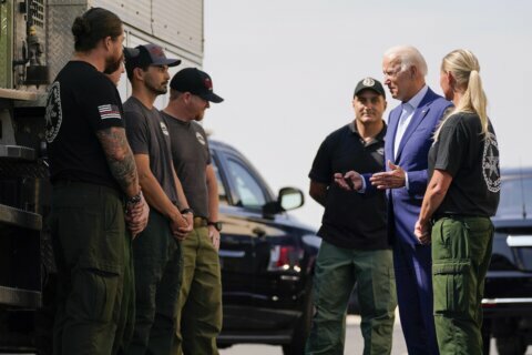 Out West, Biden points to wildfires to push for big rebuild