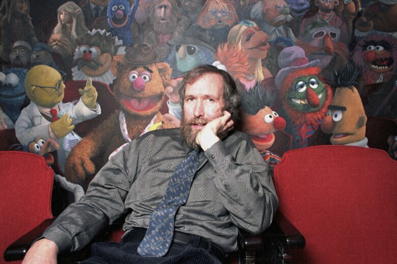 FILE - In this Dec. 30, 1985 file photo, creator of the Muppets Jim Henson poses in his 69th Street office in New York City. The American creator of the Muppets was honored Tuesday, Sept, 7, 2021 in Britain with a blue plaque at his former home in north London, which he bought after ‘The Muppet Show’ was commissioned for British television — 50 Downshire Hill in Hampstead in north London to be precise. (AP Photo/Burnett, FIle)