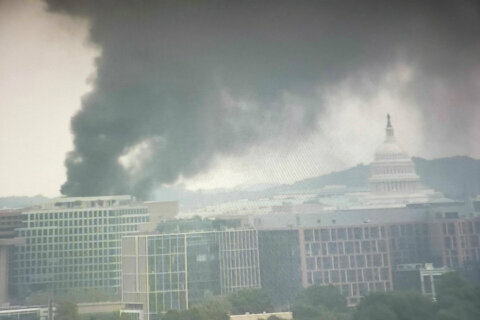 Fire on roof of future Metro HQ spews smoke through area