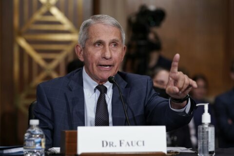 It may take many more vaccine mandates to end the pandemic, Fauci says
